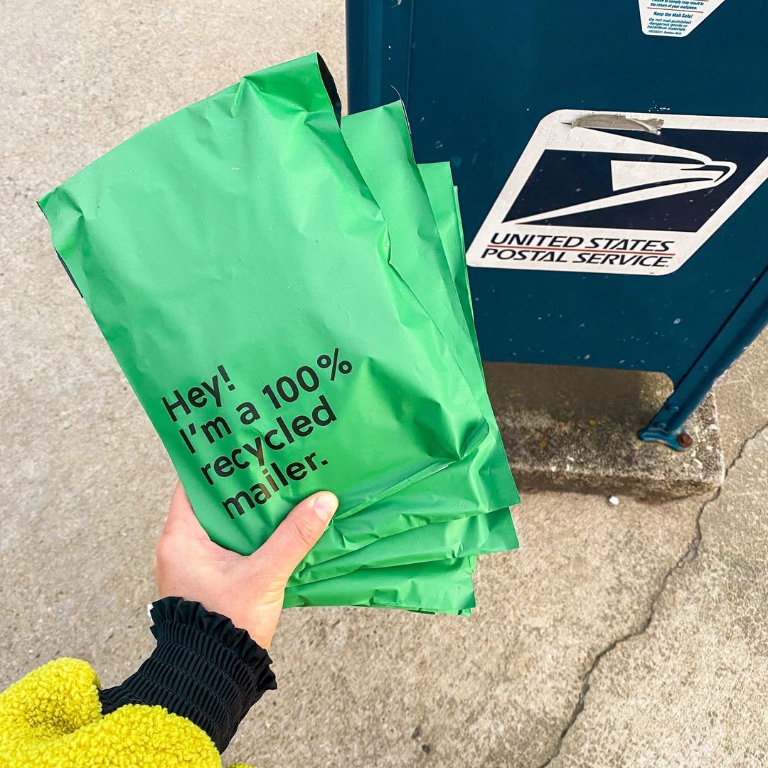 Recycled mailers being put in a post box