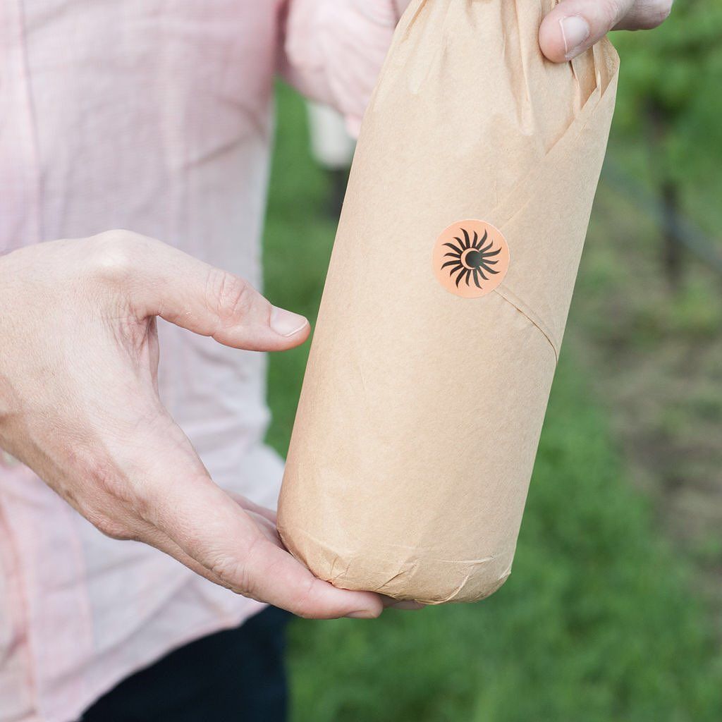 Wine bottle sealed with a custom sticker